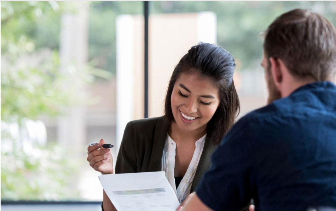 Graduate discussing student loan repayment options with a career or financial advisor.