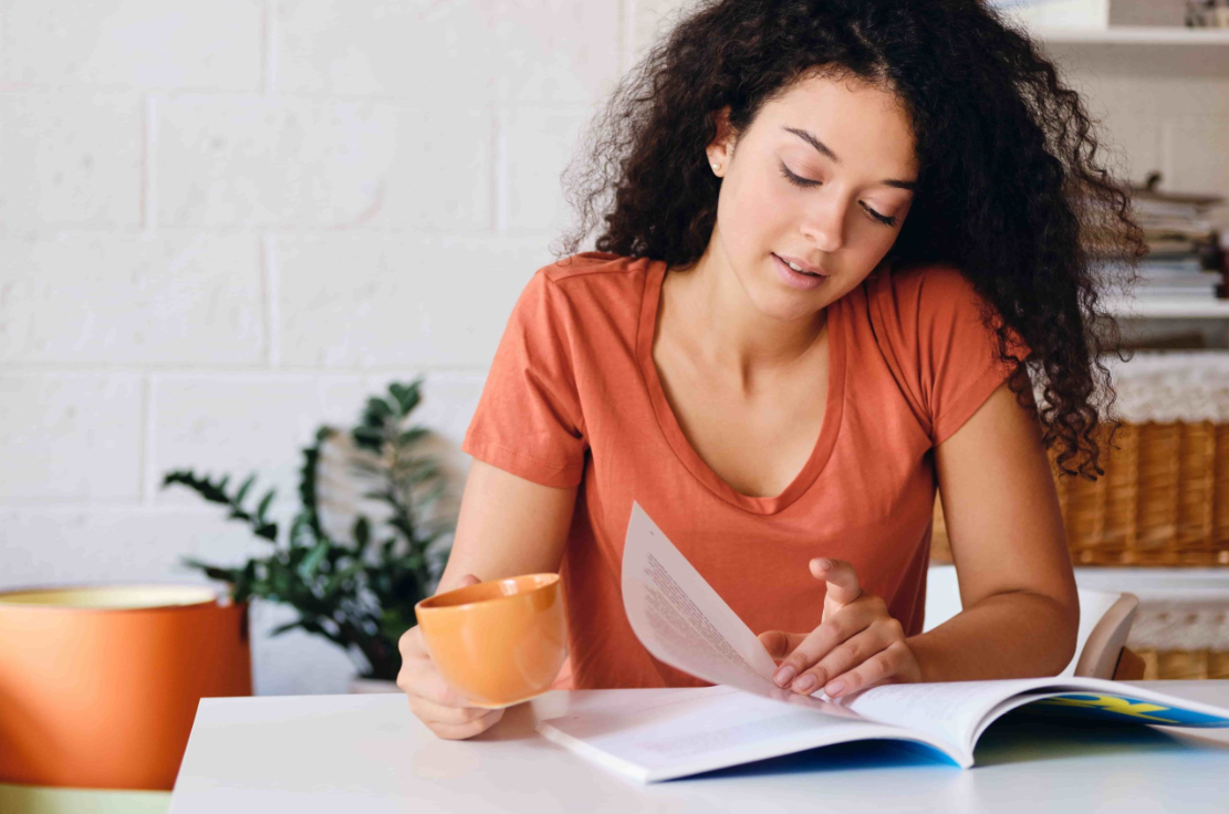 Student reviewing course materials at home while preparing for a mandatory co-op, internship, or practicum placement in Canada.