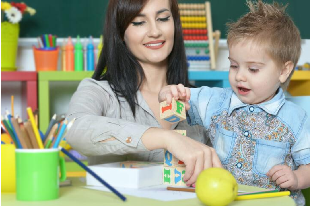 An early childhood educator guides children through an open-ended activity using art supplies, toys, and learning materials. Creativity allows educators to design meaningful experiences that encourage imagination, exploration, communication, and problem-solving. It also helps them adapt activities to suit different developmental stages, interests, and learning styles.